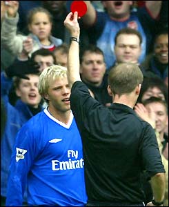 Eidur Gudjohnsen is shown the red card by Mike Riley