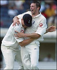 Andrew Flintoff celebrates with Steve Harmison