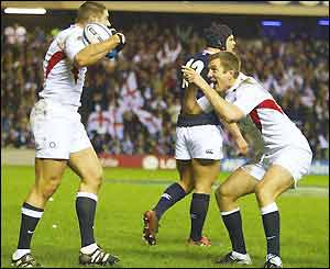 Ben Cohen celebrates scoring England's first try with team-mate Will Greenwood