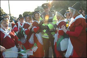 Welsh fans in Dublin get in the mood by accosting an Irish policeman