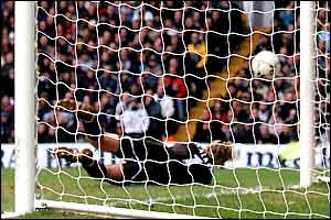 Ian Walker lets Michael Brown's free kick into the net
