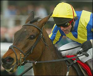 Carl Llewellyn riding Fundementalist on his way to winning the Royal and Sun Alliance Novices' Hurdle