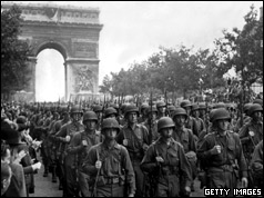 US troops march along the Champs Elysee
