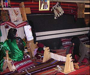 Saudi artisans demonstrating rug making