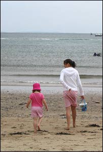 Rhiannon Griffin walking Elloise Curry to get water from the sea at Oxwich Bay, taken by Chris Curry.