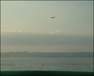 An aeroplane coming into land at Cardiff International Airport, taken from the Bristol Channel by Ioan Dyer, from Caerphilly
