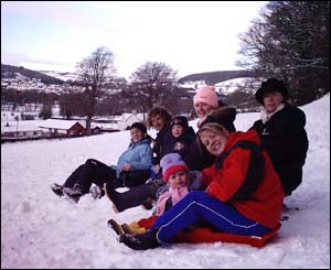 Nia, Osian, Morgan, Carys, Rhiannon, Mari and Geinor having fun on sledges (Dylan Lewis) 