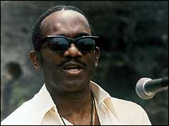 Sir Eric Gairy speaking at microphone