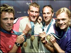 British rowers (left to right) James Cracknell, Matthew Pinsent, Steve Redgrave and Tim Foster hold the gold medals 