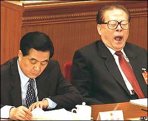 China's head of the Central Military Commission, Jiang Zemin (R) yawns next to President Hu Jintao