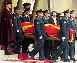 Army officers carrying coffin