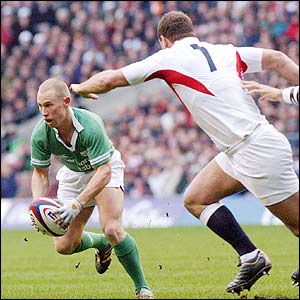Peter Stringer with the ball as Ireland attack England