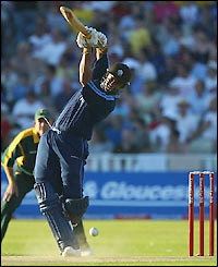 Scott Newman plays some shots as dusk starts to fall before departing in the 11th over