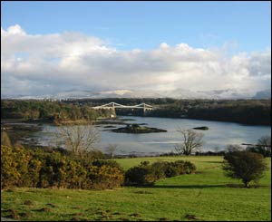 The Menai Strait and Menai Bridge, with snow on the mountains in the background (Andrew Woodvine) 