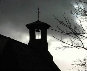 The church in Waunfawr against a gathering storm, captured by Peter Roberts of Bontnewydd