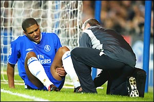 Chelsea's Glen Johnson receives treatment