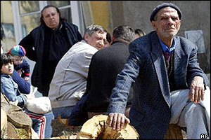 Group of displaced Kosovo Serbs await help from peacekeepers to return to their homes in central Kosovo