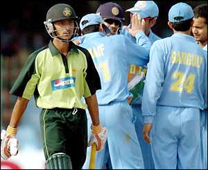 Yasir Hameed leaves the crease while India celebrate