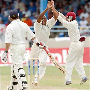 Mark Butcher walks as Tino Best celebrates