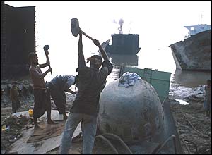 Ship-breaker wields a hammer at Alang