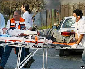 A wounded Israeli taken from the scene of a twin Hamas suicide bombing in Ashdod on 14 March 2004