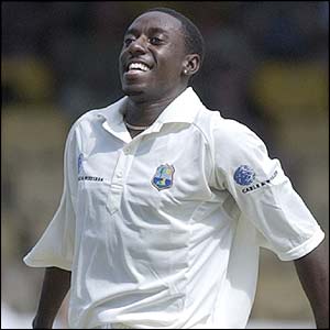Pedro Collins takes the wicket of Ashley Giles