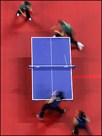 Algeria (green) and Tunisia compete during the women's doubles table tennis match