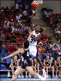 America's Sheryl Swoopes scores over the top of Leanne Walker