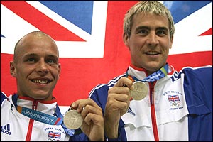 Peter Waterfield and Leon Taylor pose in front of a union jack
