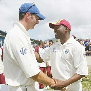 England captain Michael Vaughan shakes hand with Windies skipper Brian Lara