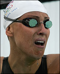 Sarah Price cries after injuring herself before the 100m backstroke semi-final