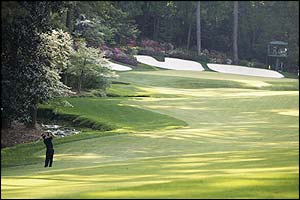 Mike Weir of Canada plays his second shot on the 13th hole