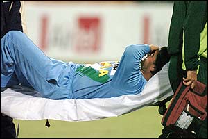 Sourav Ganguly hurts his back when fielding a shot from Inzamam 