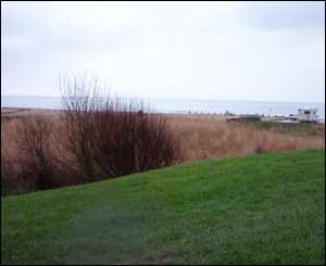 The view of the sea and beach from the former toilet block