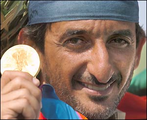 Sheikh Ahmed Al-Maktoum takes the Olympic crown for double trap shooting from Britain's defending champion Richard Faulds