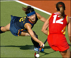 Fu Baorong of China fires a shot towards goal
