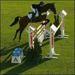 Pippa Funnell riding Primmire's Pride jumps over an obstacle