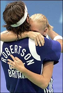 Mixed doubles Robertson and Emms hug after beating Denmark