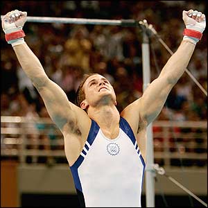Paul Hamm of the USA celebrates after the horizontal bar 