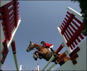 Jaroslav Hatla of the Czech Republic guides Jannalla's Boy over an obstacle in the individual three day eventing jumping qualifying competition