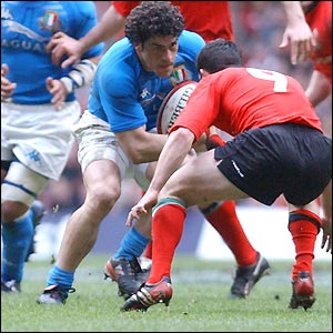 Italy's Andrea Masi comes face to face with Wales' Gareth Cooper 