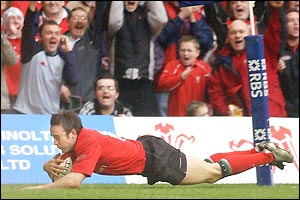 Rhys Williams dives over in the corner to score Wales' second try