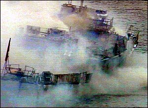 Ship smokes from explosions