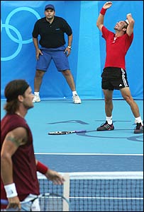 Massu (right) celebrates beating Moya (left)