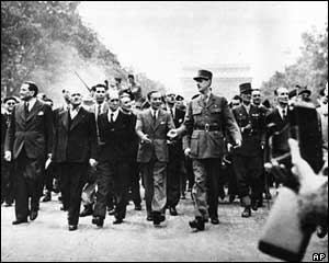 General Charles de Gaulle leads a parade through the streets of Paris