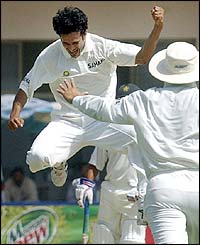  Irfan Pathan celebrates as he takes the wicket of Taufeeq Umer 