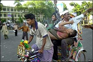 Injured victim carried a tricycle rickshaw