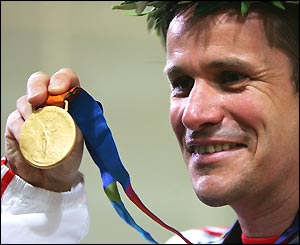 Germany's Ralf Schumann shows off his gold medal