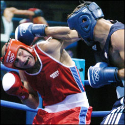 Ramadan Yasser (L) of Egypt defends against Marian Simion (R) of Romania 