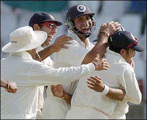India's players celebrate the wicket of Razzaq